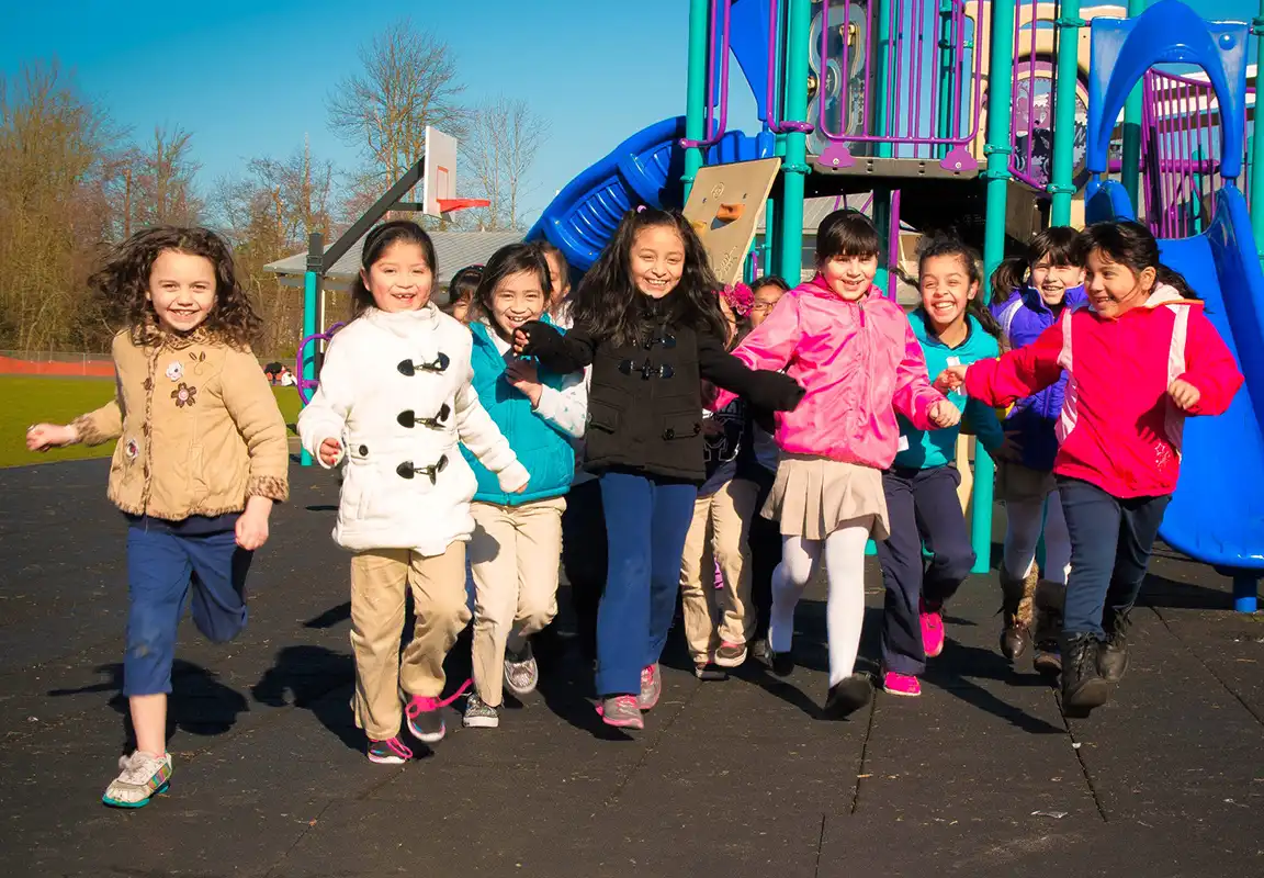 girls running in playground